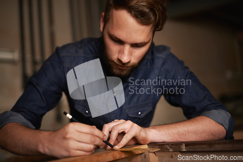 Image of Carpentry, furniture design and man with pencil, wood and designer table manufacturing workshop. Creativity, small business trade and expert carpenter with focus on sustainable woodwork project craft