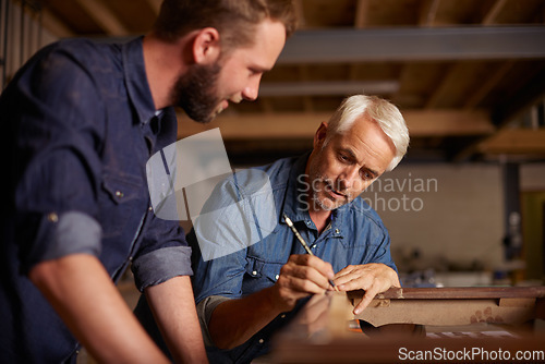 Image of Carpentry, learning and man with apprentice in training, teaching and tips for professional furniture manufacturing. Mentorship, expert carpenter and student working at wood design project workshop.