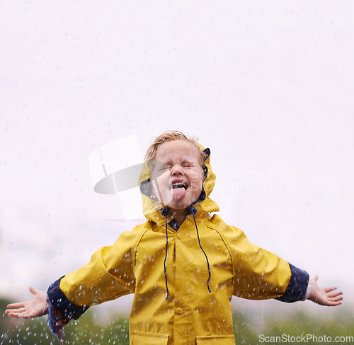 Image of Girl outdoor, rain and play in space for mockup with tongue, happiness or winter fashion. Female kid, raincoat or playing with water, open hands and excited face on adventure with freedom in mock up