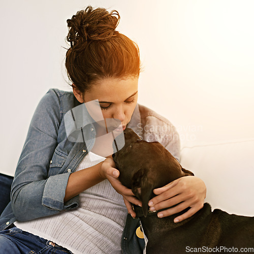 Image of Kiss, dog and woman together on sofa or animal, happy owner and physical affection, love and hugs. Girl, canine and pet smooch and building quality relationship with care, play or hug