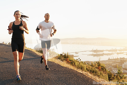 Image of Morning, fitness and couple running as exercise or workout for health and wellness together in sunrise. Sport, man and woman runner run with athlete as training listening to sports music for energy