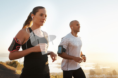 Image of Wellness, fitness or people running and listening to music in morning workout or exercise for wellness. Sport, man and woman runner with athlete as training for marathon run, sports or energy radio