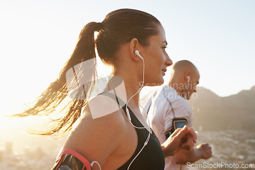 Image of Streaming, fitness and running couple doing exercise or morning workout for health and wellness together. Sport, man and woman runner run with athlete while training and listening to sports music