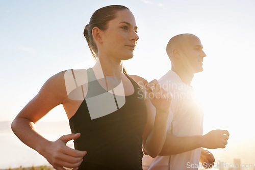 Image of Sunrise, fitness and happy couple running as exercise, performance and morning workout for heath and wellness in nature. Sport, energy and people training for a marathon or sports health together