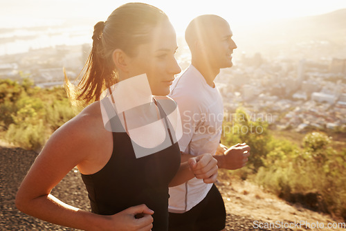 Image of Sunrise, wellness and friends running as workout or morning exercise for health and fitness together. Sport, man and woman runner run with athlete as training in a city for sports or energy