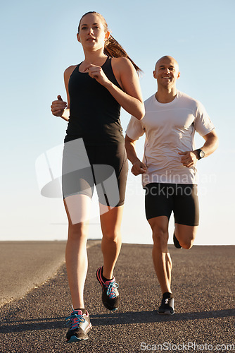 Image of Road, training and personal trainer running with woman as workout or morning exercise for health and wellness. Sport, man and street runner with athlete as fitness for a marathon, sports and energy