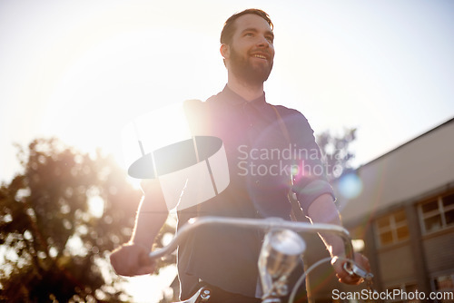Image of Travel, happy and man with bicycle walking in road with lens flare for exercise, commute and cycling. Transport, morning and male cyclist for eco friendly traveling, carbon neutral bike and journey
