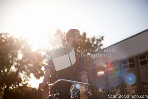 Image of Bicycle, travel and man with lens flare happy for exercise, commute and cycling in morning. Transport, city and male cyclist with bike for eco friendly traveling, carbon footprint ride and journey