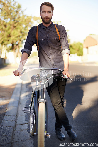 Image of Bicycle, transport and portrait of man travel with lens flare for exercise, commute and cycling in morning. Energy, city and male cyclist on bike for eco friendly, carbon neutral traveling or journey