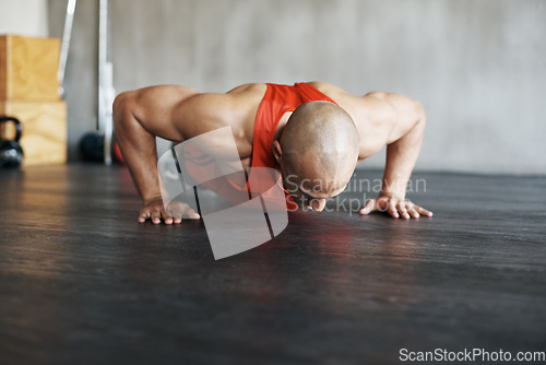 Image of Fitness, floor exercise and man doing push up for strength workout, gym practice or bodybuilder training. Endurance challenge, discipline and strong male athlete doing studio exercises on ground