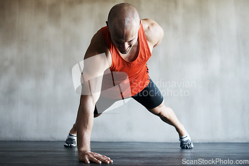 Image of Fitness, strong man and one arm push up for gym studio exercise, bodybuilder workout or sports training. Endurance challenge, muscle building or active male athlete doing floor pushup for health goal