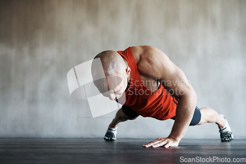 Image of Gym, man and one arm push up for exercise performance, workout determination and sports training focus. Athlete discipline, strength endurance mockup or active male person concentrate on floor pushup
