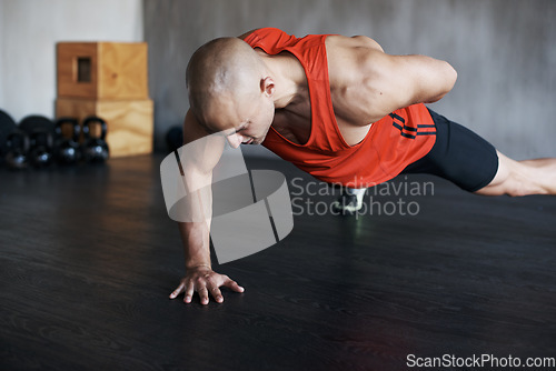 Image of Training, muscle endurance and strong man doing push up for healthy lifestyle, strength development or health club commitment. One arm pushup, motivation and male athlete workout, fitness or exercise