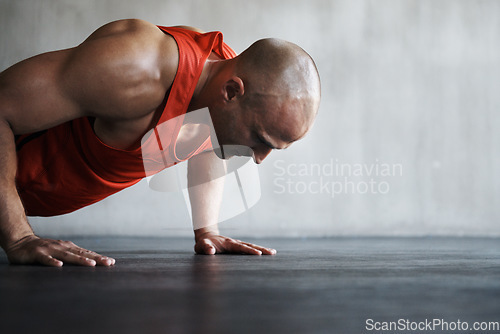 Image of Workout, endurance focus and man doing push up for strength exercise, gym commitment and muscle power endurance. Fitness mockup, motivation and person concentrate on training, exercising or practice