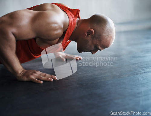 Image of Strong, muscle and man doing floor push up for sports endurance, determination or body fitness commitment. Bodybuilder profile, health mindset or active person workout, bodybuilding or floor exercise