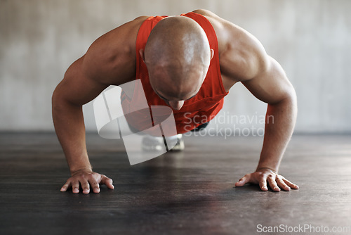 Image of Muscle growth, strong man and floor push up for athlete fitness lifestyle, studio challenge or health goals commitment. Strength, muscular or active person workout, bodybuilding or exercise on ground