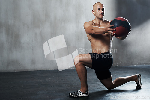 Image of Medicine ball, gym or serious man focus on fitness workout for body health, core muscle building and strength performance. Determination, training motivation or mockup person with exercise equipment