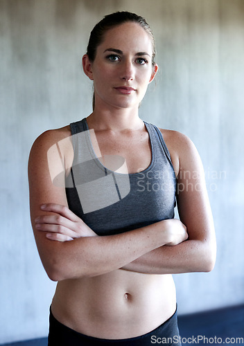 Image of Workout, arms crossed and portrait of woman confident after health club exercise, fitness studio performance or gym training. Athlete lifestyle, motivation and healthy female person with confidence