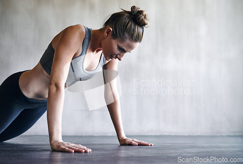 Image of Workout, gym and woman doing floor push up for exercise, health commitment and training for muscle building growth. Fitness mockup, healthy lifestyle and female athlete focus on health performance