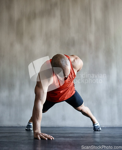 Image of Strong man, floor and one arm push up for gym studio exercise, bodybuilder workout or sports training. Fitness club motivation, endurance mockup and male athlete doing floor pushup for health goals