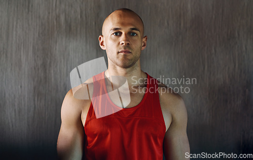 Image of Workout, serious and portrait of man confident with determined mindset, gym commitment or discipline. Athlete focus, bodybuilder confidence and healthy fitness person on concrete wall background