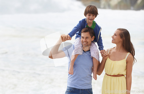 Image of Family, summer and walking outdoor at beach for travel holiday with a smile and fun. A man, woman and child or son on shoulders while playing together on vacation at sea with happiness, love and care