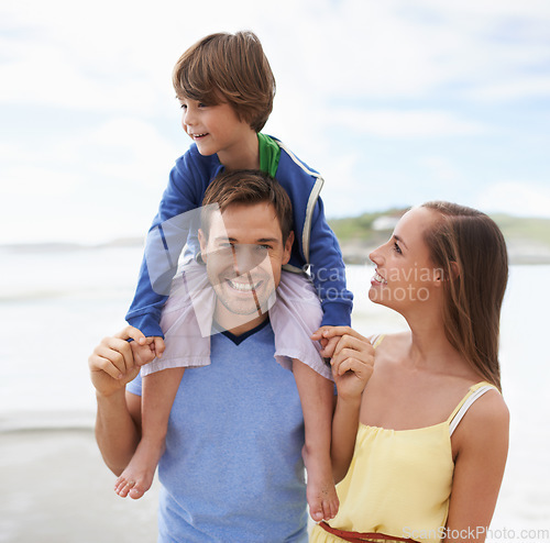 Image of Family, portrait and fun while together at beach for travel holiday in summer with a smile. Man, woman and child or son walking outdoor on vacation or adventure at sea with happiness, love and care