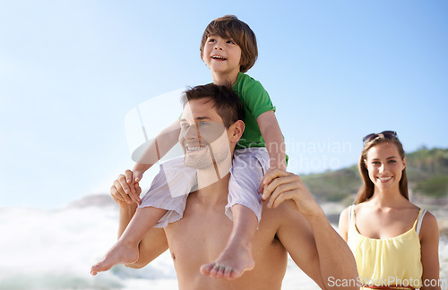 Image of Family, child and walking outdoor on beach for travel, fun or holiday in summer with a smile. Man, woman and child on shoulders for vacation, adventure or walk at sea with happiness, love and care