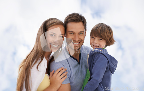 Image of Blue sky, family and child portrait outdoor with a smile for travel, adventure or holiday in summer. A man, woman and kid or son together on vacation at the beach with love, parents and happiness