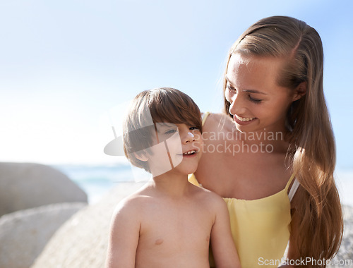 Image of Child, mother or family at beach with sunscreen on nose for sun protection on travel holiday in summer. A woman and kid happy together on vacation at sea with blue sky, skincare lotion and happiness