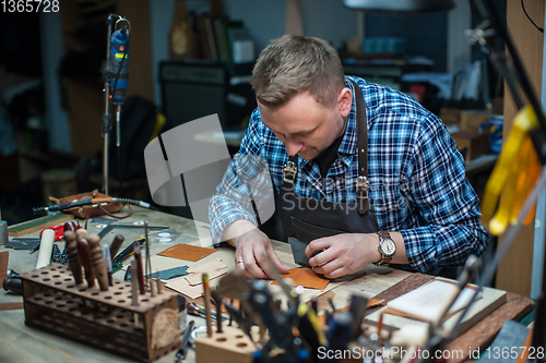 Image of Concept of handmade craft production of leather goods.