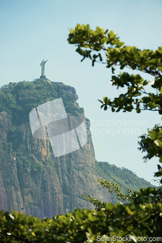 Image of Brazil, monument and Christ the Redeemer on mountain for tourism, sightseeing and travel destination. Traveling, global architecture and statue, sculpture and city landmark on Rio de Janeiro on hill
