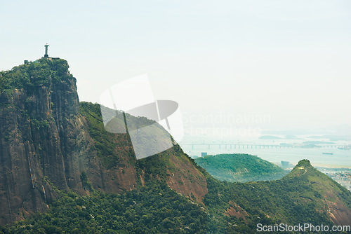Image of Mountain, nature and Christ the Redeemer in Brazil for tourism, sightseeing and travel destination. Landscape, Rio de Janeiro and drone view of statue, sculpture and landmark on hill background