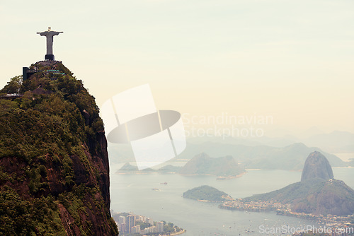 Image of Mountain, monument and aerial of Christ the Redeemer on hill for tourism, sightseeing and travel destination. Traveling mockup, Rio de Janeiro and statue, sculpture and city landmark by Brazil ocean