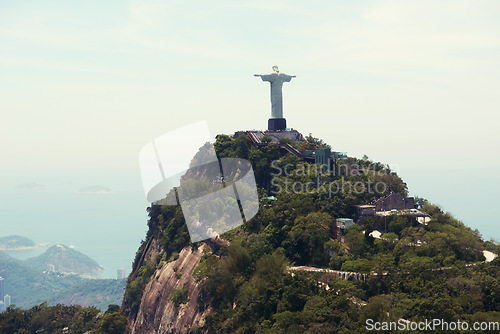 Image of Statue, monument and Christ the Redeemer in Brazil for tourism, sightseeing and global destination. Travel mockup, Rio de Janeiro and aerial view of landscape, sculpture and city landmark on mountain