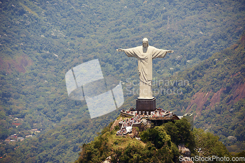 Image of Landscape, monument and Christ the Redeemer statue for tourism, sightseeing and travel destination. Traveling, Rio de Janeiro and aerial view of architecture, sculpture or landmark on Brazil mountain