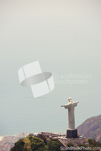 Image of Brazil, monument and Christ the Redeemer by ocean for tourism, sightseeing and travel destination. Landscape, Rio de Janeiro mockup and aerial view of statue, sculpture and landmark on mountain