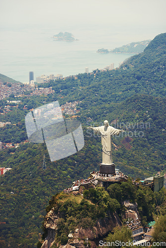 Image of Landscape, statue and aerial of Christ the Redeemer on hill for tourism, sightseeing and travel destination. Traveling, Rio de Janeiro and view of monument, sculpture and city landmark on mountain