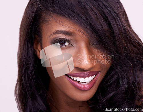 Image of Makeup, beauty and happy woman portrait in studio for glamour, treatment and cosmetics, cheerful and confident. Face, smile and beautiful african female model posing with glowing skin in closeup
