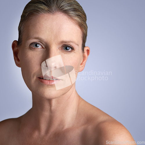 Image of Face, skincare and portrait of mature woman doing cosmetic skin care facial isolated in a grey studio background. Cosmetics, wellness and old female model calm with natural beauty due to anti aging