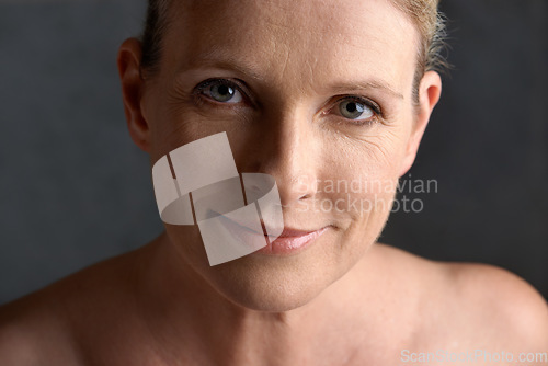 Image of Face, smile and portrait of mature woman doing beauty cosmetic skincare isolated in a black studio background. Cosmetics, care and old female model calm with natural skin due to anti aging