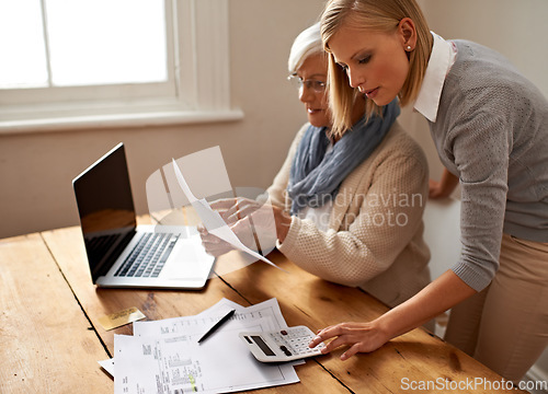 Image of Calculator, senior mother and daughter helping for taxes or laptop or table for bills and money at home. Retirement, budget and old woman or pension for bookkeeping or family finance and saving