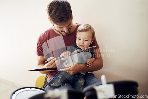 Image of Happy father, baby and child drum lesson with music development and kids learning. Home, happiness and bonding with youth and dad together with a smile, instrument and parent care at a family house