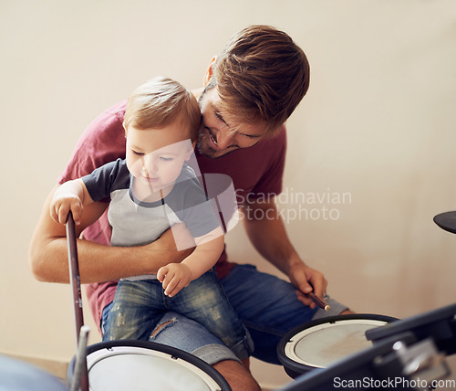 Image of Dad, baby and drummer teaching for music development and child learning. Home, father happiness and kid instrument together with youth lesson with a smile, love and parent care at a family house