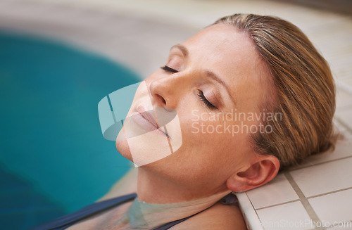 Image of Swimming pool, rest and woman relax on holiday, summer vacation and weekend getaway. Travel, luxury spa resort and calm female person relaxing in water for happiness, wellness and peace outdoors