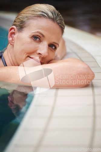 Image of Swimming pool, portrait and woman relax on holiday, summer vacation and weekend getaway. Travel, luxury spa resort and happy female person relaxing in water for happiness, wellness and peace outdoors