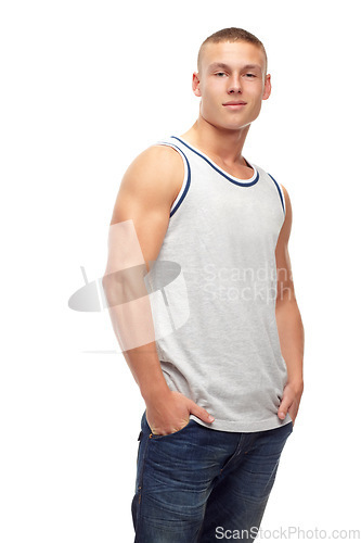 Image of Man, confident smile and portrait with fashion and modern style in studio. White background, jeans and young male model with muscles and clothing with youth and attitude feeling cool with confidence