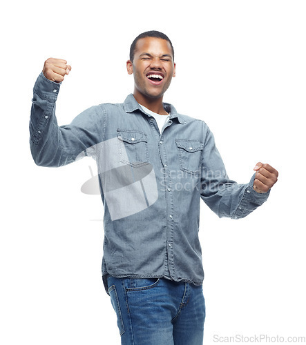 Image of Happy, excited and man celebration portrait in studio with casual fashion and yes hands from win. Smile, winning and achievement of a African male and model with white background and winner fist