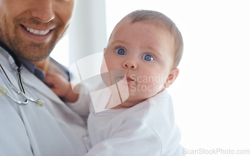 Image of Funny, face and baby with pediatrician in hospital for medical support and growth in portrait. Cute newborn kid, pediatrics doctor and healthcare service, expert consulting and clinic for children