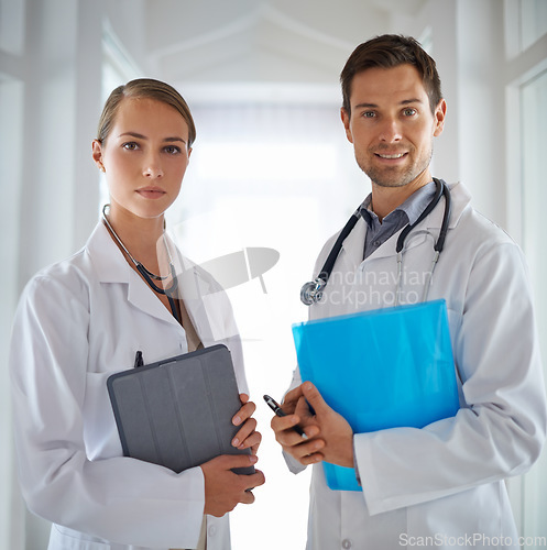 Image of Portrait of doctors, teamwork and hospital for healthcare management, clinic services and professional consulting. Man, woman and medical employees with folder for collaboration, integrity and trust